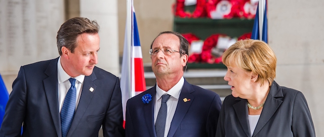 From left, British Prime Minister David Cameron, French President Francois Hollande and German Chancellor Angela Merkel participate in a ceremony to mark the Centenary of World War I at the Menin Gate in Ypres, Belgium on Thursday, June 26, 2014. Where their countrymen once slaughtered each other with machine guns, artillery and poison gas, the leaders of Britain, Germany and the other member states of the European Union gather Thursday to solemnly mark the 100th anniversary of the start of World War I and rededicate themselves to peace and working together. (AP Photo/Geert Vanden Wijngaert)