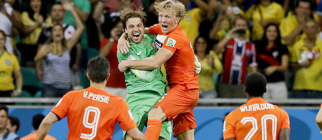 Netherlands' goalkeeper Tim Krul, center left, celebrates after making the final save in a penalty shoot out during the World Cup quarterfinal soccer match between the Netherlands and Costa Rica at the Arena Fonte Nova in Salvador, Brazil, Saturday, July 5, 2014. The Netherlands won 4-3 0n penalties after the match ended 0-0 after extra time. (AP Photo/Matt Dunham)