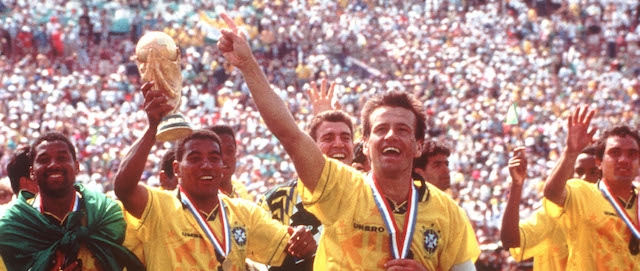 Members of Brazil's winning World Cup team parade around the Rose Bowl field in Pasadena, California, Sunday, July 17, 1994, after they defeated Italy in a penalty shootout, 3-2, before more than 94,000 spectators. From left are: Gilmar (22), Viola (21), Mauro Silva (5, with World Cup trophy), Dunga (8, who scored the winning goal), and Branco (6). The Brazilians took a record fourth title. (AP-PHOTO/stf/Bruno Luca)