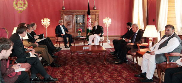 This image released by the Afghan presidential palace shows U.S. Secretary of State John Kerry, left, talking with Afghanistan's President Hamid Karzai, right, at the presidential palace in Kabul, Afghanistan, Friday, July 11, 2014. Secretary of State Kerry sought Friday to broker a deal between Afghanistan's rival presidential candidates as a bitter dispute over last month's runoff election risked spiraling out of control. (AP Photo/Afghan presidential palace )