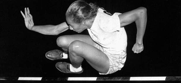 File-This July 8, 1948, file photo shows Alice Coachman of Albany, Ga., clearing the bar at five feet to win the running high jump in the Women's National Track Meet in Grand Rapids, Iowa. The first black woman to win an Olympic gold medal, Coachman Davis, died early Monday, July 14, 2014, in south Georgia. She was 90. (AP Photo, File)