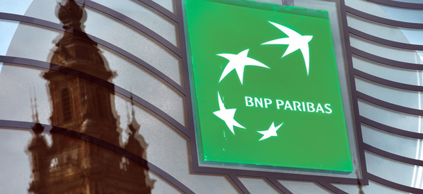 A photo taken on June 24, 2014 in Lille, northern France shows the logo of the French bank BNP Paribas. US regulators next week plan to announce a $9 billion settlement with BNP Paribas to settle charges the French bank violated American sanctions, a person familiar with the talks said today. After lengthy negotiations, the big French bank, the US Department of Justice and New York state banking regulator Benjamin Lawsky have reached a broad agreement on a settlement, said the person, who spoke on the condition of anonymity. AFP PHOTO / PHILIPPE HUGUEN (Photo credit should read PHILIPPE HUGUEN/AFP/Getty Images)