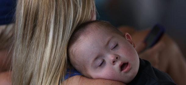 CHICAGO, IL - JUNE 28: A baby sleeps as the Chicago Cubs take on the Washington Nationals at Wrigley Field on June 28, 2014 in Chicago, Illinois. The Nationals defeated the Cubs 3-0. (Photo by Jonathan Daniel/Getty Images)