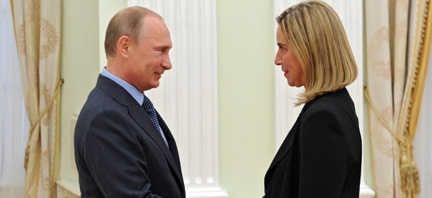 Russian President Vladimir Putin, left, greets Italian Foreign Minister Federica Mogherini, during their meeting in the Kremlin in Moscow, Russia, Wednesday, July 9, 2014. (AP Photo/RIA-Novosti, Mikhail Klimentyev, Presidential Press Service)