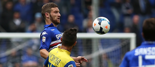 Sampdoria defender Shkodran Mustafi, left, jumps for the ball with Chievo Verona forward Cyril Thereau during a Serie A soccer match between Sampdoria and Chievo Verona, in Genoa, Italy, Sunday, April 27, 2014. (AP Photo/Carlo Baroncini)