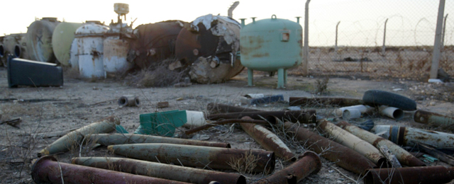 Discarded shells and cement filled tanks litter the Al-Muthanna State Establishment 40 miles, 70 kilometers northwest of Baghdad after UN weapon inspectors entered the complex Wednesday Dec. 4, 2002. the Al-Muthanna complex was the main production facility for chemical and biological agent production in the 1990s. Previous weapon inspection teams rendered the facility inoperative. Previous weapon inspection teams rendered the facility inoperative. Looters unleashed last year by the U.S.-led invasion of Iraq overran the sprawling desert complex where a bunker sealed by U.N. monitors held old chemical weapons, American arms inspectors report in Sept. 2004. (AP Photo/Jerome Delay)