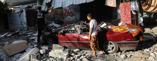 Palestinians inspect the rubble of a house after it was hit by an Israeli missile strike in Gaza City, Thursday, July 10, 2014. Israel dramatically escalated its aerial assault in Gaza Thursday, hitting hundreds of Hamas targets as its missile defense system once again intercepted rockets aimed at the country’s heartland. (AP Photo/Hatem Moussa)