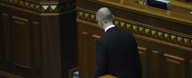 Ukrainian Prime Minister Arseniy Yatsenyuk leaves after speaking in the parliament in Kiev, Ukraine, Thursday, July 24, 2014. Arseniy Yatsenyuk announced his resignation Thursday, a move that opens the way for new elections that would reflect a the country’s starkly changed political scene after the ouster of pro-Russian President Viktor Yanukovych in February. (AP Photo/Andrew Kravchenko, Pool)
