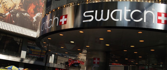 NEW YORK, NY - SEPTEMBER 12: People walk by a Swatch store in Times Square on September 12, 2011 in New York City. Watchmaker Swatch Group announced Monday that it has terminated its partnership with Tiffany & Co. The companies' partnership, which goes back to late 2007, was ended as Swatch accused the jeweler of trying to delay a joint venture between the two companies. (Photo by Spencer Platt/Getty Images)