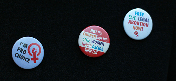 A selection of "Pro-Choice" badges are displayed on the coat of a demonstrator during a march from the Garden of Remembrance to the Dail (Irish Parliament) in Dublin, Ireland on November 17, 2012. Ireland's tough abortion laws came under fire following the death of the Indian woman Halappanavar after doctors allegedly refused her a termination because it was against the laws of the Catholic country. The Indian woman, who was 17 weeks pregnant, repeatedly asked the hospital to terminate her pregnancy because she had severe back pain and was miscarrying, her family said. AFP PHOTO / PETER MUHLY (Photo credit should read PETER MUHLY/AFP/Getty Images)