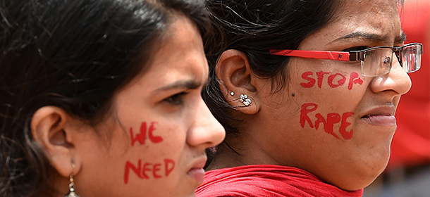 Indian activists participate in a rally organised by "The Red Brigade - Bring Bangalore Back" to protest against the recent incidents of sexual abuse, molestation and rapes against women in Bangalore on July 20, 2014. The protestors demanded police take action against sexual offenders, child sexual abuse and rapists after several cases of sexual violence against women were registered in Bangalore in the last few days. AFP PHOTO/Manjunath Kiran (Photo credit should read Manjunath Kiran/AFP/Getty Images)