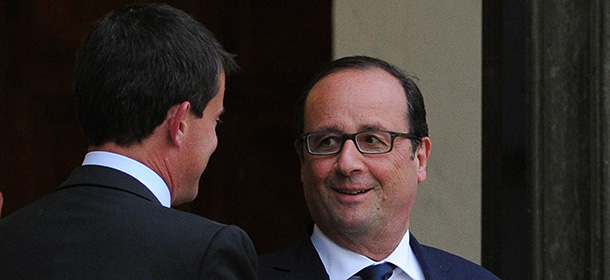 French Prime Minister Manuel Valls (L) bids farewell to French President Francois Hollande as he leaves the Elysee presidential palace after a meeting in Paris on August 25, 2014. Hollande asked Valls to form a new government following a much-criticised show of insubordination by the country's firebrand economy minister. A presidency statement said Valls had offered the resignation of his government -- a formality that allows him to form a new cabinet -- and the new line-up would be announced on August 26. AFP PHOTO / DOMINIQUE FAGET (Photo credit should read DOMINIQUE FAGET/AFP/Getty Images)