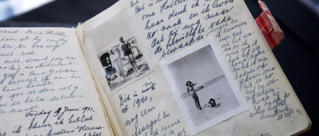 A facsimile of Anne Frank's diary displayed during a press conference at Anne Frank House in Amsterdam, Netherlands, Thursday, June 11, 2009. The Anne Frank House museum says it will permanently exhibit her diaries and other writings as part of activities commemorating the 80th anniversary of her birth on June 12, 1929. Frank died aged 15 in a concentration camp, but her posthumously published diary has made her a symbol of all Jews killed in World War II. (AP Photo/ Evert Elzinga)