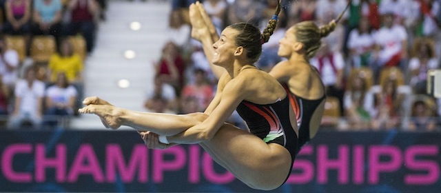 Italy's Tania Cagnotto, front, and Francesca Dallape compete to win the women's synchronized 3m springboard final at the LEN Swimming European Championships in Berlin, Germany, Saturday, Aug. 23, 2014. (AP Photo/Gero Breloer)