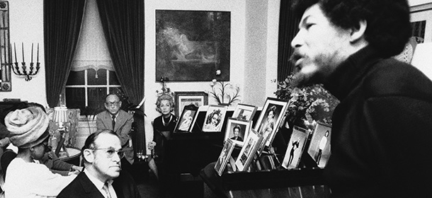 Bearded Donald Lee Cox, field marshal of the Black Panther Party speaking at Cocktail Party in Elegant Duplex of Conductor Leonard Bernstein on New York?s Park Avenue in January 1970. In center background is Mrs. Bernstein. In foreground is Leon Quat, a lawyer. (AP Photo)
