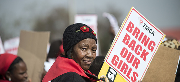 A woman hold a placard as hundreds of Soweto residents march at the YMCA in Soweto, Johannesbourg, on May 22, 2014, to demonstrate for the release of more than 200 schoolgirls kidnapped by Islamist militant group Boko Haram in Nigeria. The United States has deployed 80 military personnel to Chad to help findthe 223 girls still missing since their abduction on April 14, 2014. AFP PHOTO/ MUJAHID SAFODIEN (Photo credit should read MUJAHID SAFODIEN/AFP/Getty Images)
