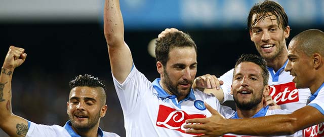 Napoli's Argentinian forward Gonzalo Higuain with teammates, Italian forward Lorenzo Insigne (L), Belgian forward Dries Mertens (3R), Spanish forward Michu (2R) and Swiss midfielder Gokhan Inler (R) after scoring a goal during the friendly football match between SSC Napoli and Paris Saint-Germain FC as part of the 2014 Acqua Lete Cup, on August 11, 2014 at the San Paolo Stadium, in Naples. AFP PHOTO / CARLO HERMANN (Photo credit should read CARLO HERMANN/AFP/Getty Images)