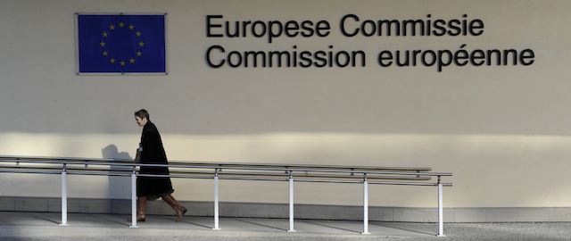 This photo taken on February 8, 2011 shows a man walking in front of the European Union Commission building at the EU Headquarters in Brussels. AFP PHOTO / JOHN THYS (Photo credit should read JOHN THYS/AFP/Getty Images)