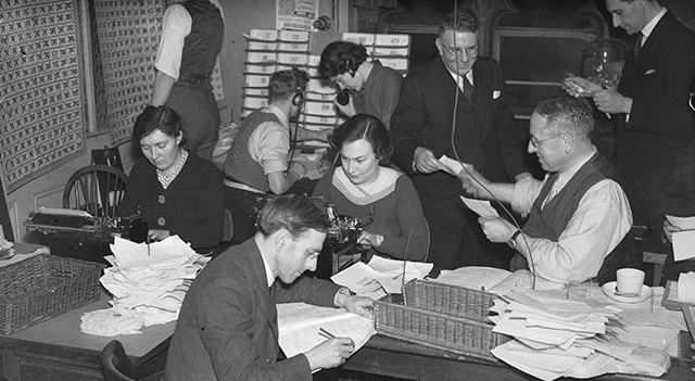 November 1935: Journalists at Reuters Press Agency receive results of the General Election. (Photo by Fox Photos/Getty Images)