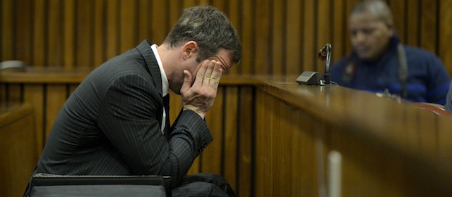 BY COURT ORDER, THIS IMAGE IS FREE TO USE. PRETORIA, SOUTH AFRICA -AUGUST 8: Oscar Pistorius sits in the dock during closing arguments in his murder trial in the Pretoria High Court on August 8, 2014, in Pretoria, South Africa. Oscar Pistorius stands accused of the murder of his girlfriend, Reeva Steenkamp, on February 14, 2013. This is Pistorius' official trial, the result of which will determine the paralympian athlete's fate. (Photo by Herman Verwey/Pool/Foto24/Gallo Image/Getty Images)