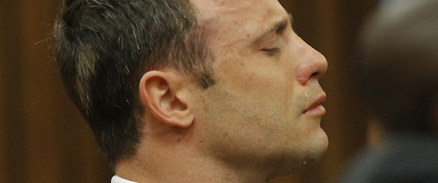 BY COURT ORDER, THIS IMAGE IS FREE TO USE. PRETORIA, SOUTH AFRICA - SEPTEMBER 11 (SOUTH AFRICA OUT): Oscar Pistorius cries while seated in the dock during the verdict in his murder trial at the Pretoria High Court on September 11, 2014, in Pretoria, South Africa. Pistorius, stands accused of the murder of his girlfriend, Reeva Steenkamp, on February 14, 2013. This is his' official trial, the result of which will determine the paralympian athlete's fate. Judge Masipa has began delivering her verdict.. (Photo by Kim Ludbrook/EPA/Gallo Image/Getty Images)