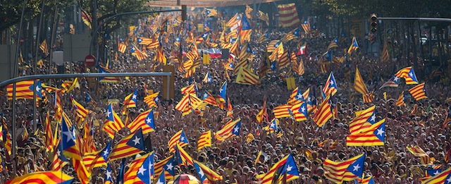 BARCELONA, SPAIN - SEPTEMBER 11: Demonstrators march during a Pro-Independence demonstration as part of the celebrations of the National Day of Catalonia on September 11, 2014 in Barcelona, Spain. Thousands of Catalans celebrating the 'Diada de Catalunya', are using it as an opportunity to hold demonstrations to demand the right to hold a self-determination referendum next November. (Photo by David Ramos/Getty Images)
