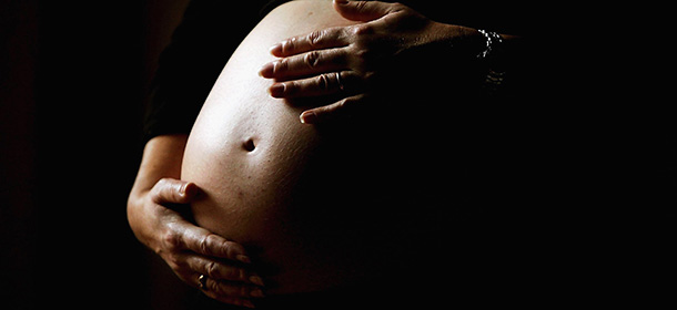 SYDNEY, NSW - JUNE 07: A pregnant woman holds her stomach June 7, 2006 in Sydney, Australia. Australia is currently enjoying a baby boom, with the Australian Bureau of Statistics registering a 2.4% increase in births from 2004 to 2005, which represents the highest number of births since 1992. The Australian Federal Government has been encouraging people to have more babies, with financial incentives and the slogan by treasurer Peter Costello to "have one for mum, one for dad, and one for the country". The Federal Government has identified falling fertility rates and the ageing population as long-term problems for Australia's growth and prosperity. (Photo by Ian Waldie/Getty Images)