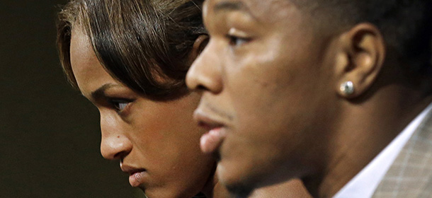 FILE - In this May 23, 2014, file photo, Janay Rice, left, looks on as her husband, Baltimore Ravens running back Ray Rice, speaks to the media during a news conference in Owings Mills, Md. A new video that appears to show Ray Rice striking then-fiance Janay Palmer in an elevator last February has been released on a website. (AP Photo/Patrick Semansky, File)