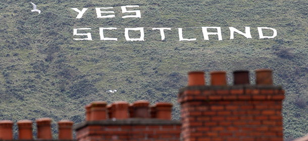 Republican writing supporting the Yes vote in the Scottish Referendum on a mountain in West Belfast, Northern Ireland, Monday, Sept. 8, 2014. Scotland is due to vote on September 18th in a referendum on Scottish independence and many people in Northern Ireland will be watching closely on its outcome. (AP Photo/Peter Morrison)
