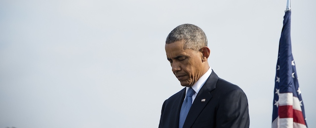 US President Barack Obama stands at the Pentagon in Washington, DC, September 11, 2014, for a moment of silence marking the 13th anniversary of the 9/11 attacks on the United States. AFP PHOTO / Jim WATSON (Photo credit should read JIM WATSON/AFP/Getty Images)