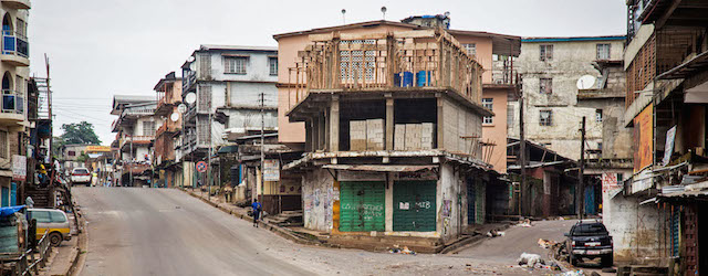 Empty streets are seen, as Sierra Leone government enforces a three day lock down on movement of all people in an attempt to fight the Ebola virus, in Freetown, Sierra Leone, Friday, Sept. 19, 2014. Thousands of health workers began knocking on doors across Sierra Leone on Friday in search of hidden Ebola cases with the entire West African nation locked down in their homes for three days in an unprecedented effort to combat the deadly disease. (AP Photo/ Michael Duff)