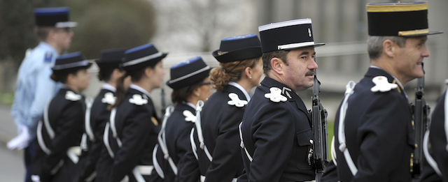 French gendarmes stand guard as the French Interior minister visits the research section of the Gendarmerie Nationale on January 9, 2014 in Rennes, western France, during his two-day trip in Brittany. AFP PHOTO / JEAN-SEBASTIEN EVRARD (Photo credit should read JEAN-SEBASTIEN EVRARD/AFP/Getty Images)