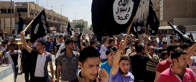 Demonstrators chant pro-al-Qaida-inspired Islamic State of Iraq and the Levant (ISIL) as they carry al-Qaida flags in front of the provincial government headquarters in Mosul, 225 miles (360 kilometers) northwest of Baghdad, Iraq, Monday, June 16, 2014. Sunni militants captured a key northern Iraqi town along the highway to Syria early on Monday, compounding the woes of Iraq's Shiite-led government a week after it lost a vast swath of territory to the insurgents in the country's north. (AP Photo)