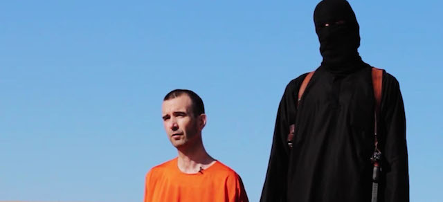 EDS NOTE: GRAPHIC CONTENT - This image made from video posted on the Internet by Islamic State militants and provided by the SITE Intelligence Group, a U.S. terrorism watchdog, on Saturday, Sept. 13, 2014, purports to show British aid worker David Haines before he was beheaded. The video emerged hours after the family of Haines issued a public plea on Saturday urging his captors to contact them. The 44-year-old Haines was abducted in Syria in 2013 while working for an international aid agency. (AP Photo)