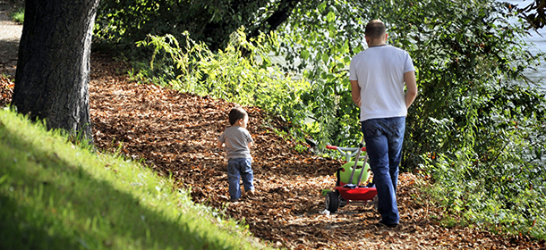 A father and his son walk in a forest, near Saint-Maur-des-Fossés eastern Paris, on October 9, 2010. AFP PHOTO BORIS HORVAT (Photo credit should read BORIS HORVAT/AFP/Getty Images)