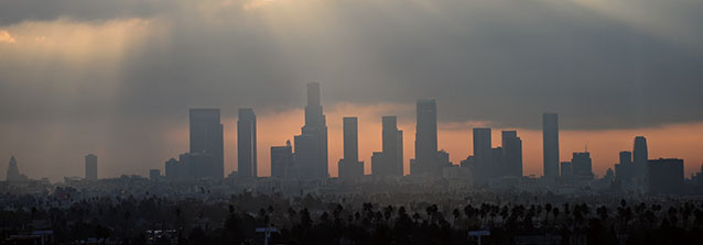 Birds fly across the sky at daybreak over the downtown Los Angeles skyline on December 14, 2011. According to the state's Air Resources Board earlier this month, California has the worst air quality in the country, with 40 percent of pollution contributed by passenger cars and light-duty trucks. AFP PHOTO / Frederic J. BROWN (Photo credit should read FREDERIC J. BROWN/AFP/Getty Images)