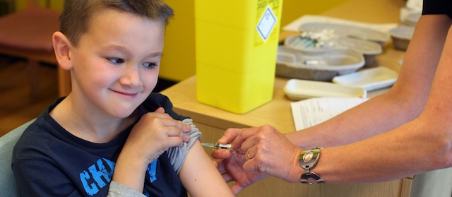 Luke Tanner, 7, receives the combined Measles Mumps and Rubella (MMR) vaccination at an MMR drop-in clinic at Neath Port Talbot Hospital near Swansea in south Wales on April 20, 2013. Public health officials said on April 19 they were investigating the first suspected death from measles in Britain in five years, after an outbreak blamed on a campaign against vaccinations. More than 800 people have contracted the highly contagious disease in Wales in the past six months, centred around the southern city of Swansea. Marion Lyons, director of health protection for Wales, said it had now been confirmed that a 25-year-old man from Swansea who died on April 18 had measles, a full postmortem will be conducted to determine cause of death. AFP PHOTO / GEOFF CADDICK (Photo credit should read GEOFF CADDICK/AFP/Getty Images)