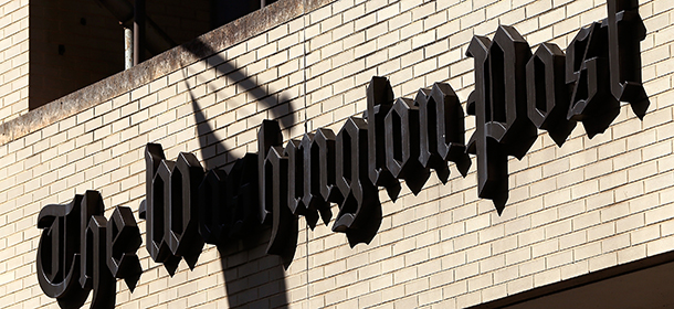 WASHINGTON, DC - SEPTEMBER 02: A sign hangs on the Washington Post building September 2, 2014 in Washington, DC. It was announced that Frederick Ryan has been named the new publisher of the newspaper. Ryan, a founding member of the Politico website leadership, was appointed by owner Jeffery Bezos to replace Katharine Weymouth, a member of the Graham family that owned the paper for more than eighty years. (Photo by Win McNamee/Getty Images)