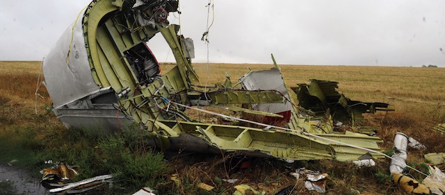 A photo taken on September 9, 2014 shows part of the Malaysia Airlines Flight MH17 at the crash site in the village of Hrabove (Grabovo), some 80km east of Donetsk. The Malaysian passenger jet which blew up over rebel-held east Ukraine with the loss of all 298 people on board was hit by numerous "high-energy objects", according to a report on September 9, 2014 which could back up claims it was downed by a missile. While the preliminary report from Dutch investigators does not point the finger of blame over the July disaster, it could heighten Western pressure against Moscow over its role in the bloody Ukraine conflict. AFP PHOTO/ ALEXANDER KHUDOTEPLY (Photo credit should read Alexander KHUDOTEPLY/AFP/Getty Images)