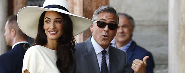 US actor George Clooney and British lawyer Amal Alamuddin arrive on September 29, 2014 at the palazzo Ca Farsetti in Venice, for a civil ceremony to officialise their wedding. AFP PHOTO / PIERRE TEYSSOT (Photo credit should read PIERRE TEYSSOT/AFP/Getty Images)