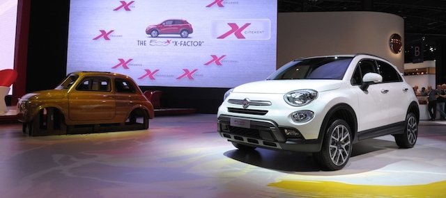 The Fiat 500 X is unveiled at the Paris Auto Show in front of the Fiat 500 wooden prototype on October 2, 2014 on the first of the two press days. AFP PHOTO / ERIC PIERMONT (Photo credit should read ERIC PIERMONT/AFP/Getty Images)