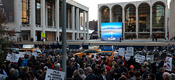 NEW YORK, NY - OCTOBER 20: Protestors hold signs outside the Metropolitan Opera at Lincoln Center on opening night of the opera, "The Death of Klinghoffer" on October 20, 2014 in New York City. The opera, by John Adams, depicts the death of Leon Klinghoffer, a Jewish cruise passenger from New York, who was killed and dumped overboard during a 1985 hijacking of of an Italian cruise ship by Palestinian terrorists. The opera has been accused of anti-Semitism and, at its opening tonight, demonstrators, including former New York City Mayor Rudy Giuliani, protested its inclusion in this year's schedule at the Metropolitan Opera. (Photo by Bryan Thomas/Getty Images)