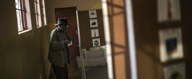 A man casts his ballot at a polling station in Serewe on October 24, 2014 for Botswana's general elections. Voters went to the polls in Botswana's general elections on October 24, with the ruling party facing an unprecedented test against an invigorated opposition in one of Africa's most stable democracies. AFP PHOTO/MARCO LONGARI (Photo credit should read MARCO LONGARI/AFP/Getty Images)
