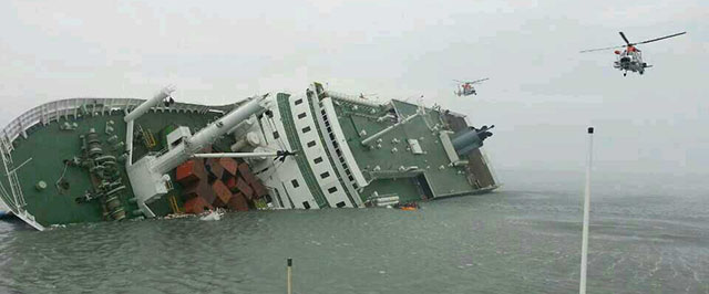 JINDO-GUN, SOUTH KOREA - APRIL 16: In this handout image provided by the Republic of Korea Coast Guard, a passenger ferry sinks off the coast of Jindo Island on April 16, 2014 in Jindo-gun, South Korea. The ferry identified as the Sewol was carrying about 470 passengers, including students and teachers, traveling to Jeju island. (Photo by The Republic of Korea Coast Guard via Getty Images)