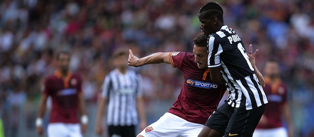 AS Roma's forward Francesco Totti (L) vies with Juventus' French midfielder Paul Labile Pogba during the Italian Serie A football match AS Roma vs Juventus on May 11, 2014 at Rome's Olympic stadium. AFP PHOTO / FILIPPO MONTEFORTE (Photo credit should read FILIPPO MONTEFORTE/AFP/Getty Images)