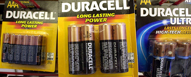 Duracell batteries hang from hooks on display at an office supply store in Boston, Wednesday, March 28, 2001. Gillette, the parent company of the battery manufacturer, said Wednesday its Duracell unit would relaunch the "Copper and Black" battery brand with a $100 million global marketing campaign. (AP Photo/Steven Senne)