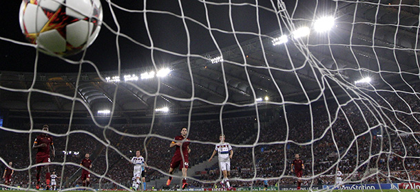 A ball hits the net as Bayern scores against Roma during the Group E Champions League soccer match between Roma and Bayern Munich at the Olympic stadium, in Rome, Tuesday, Oct. 21, 2014. (AP Photo/Andrew Medichini)