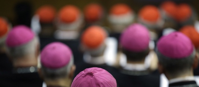 Bishops and Cardinals attend a morning session of a two-week synod on family issues at the Vatican, Monday, Oct. 13, 2014. (AP Photo/Gregorio Borgia)