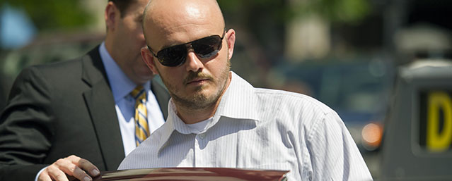 Former Blackwater Worldwide guard Nicholas Slatten enters a taxi cab as he leaves federal court in Washington, Wednesday, June 11, 2014, after the start of his first-degree murder trial. Slatten and three other Blackwater Worldwide guards are on trial for the killing of 14 Iraqi civilians and the wounding of 18 others in bloodshed that inflamed anti-American sentiment around the globe. (AP Photo/Cliff Owen)