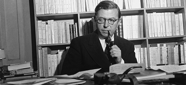 French playwright and philosopher Jean-Paul Sartre is shown in his study in Paris, on November 28, 1948. (AP Photo)